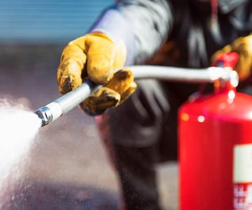 Close Up As A Foam Fire Extingusher Is Used.