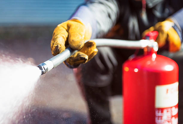 Close Up As A Foam Fire Extingusher Is Used.